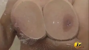 Pressed my breasts against the glass and then masturbate with a strea