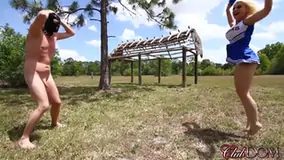 A cheerleaders kicking bag